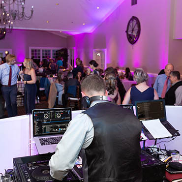 Wedding DJ Mixing Music in central Mass